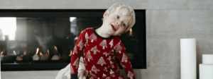 toddler sits in front of newly installed gas fireplace