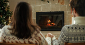 Couple looking at fire place